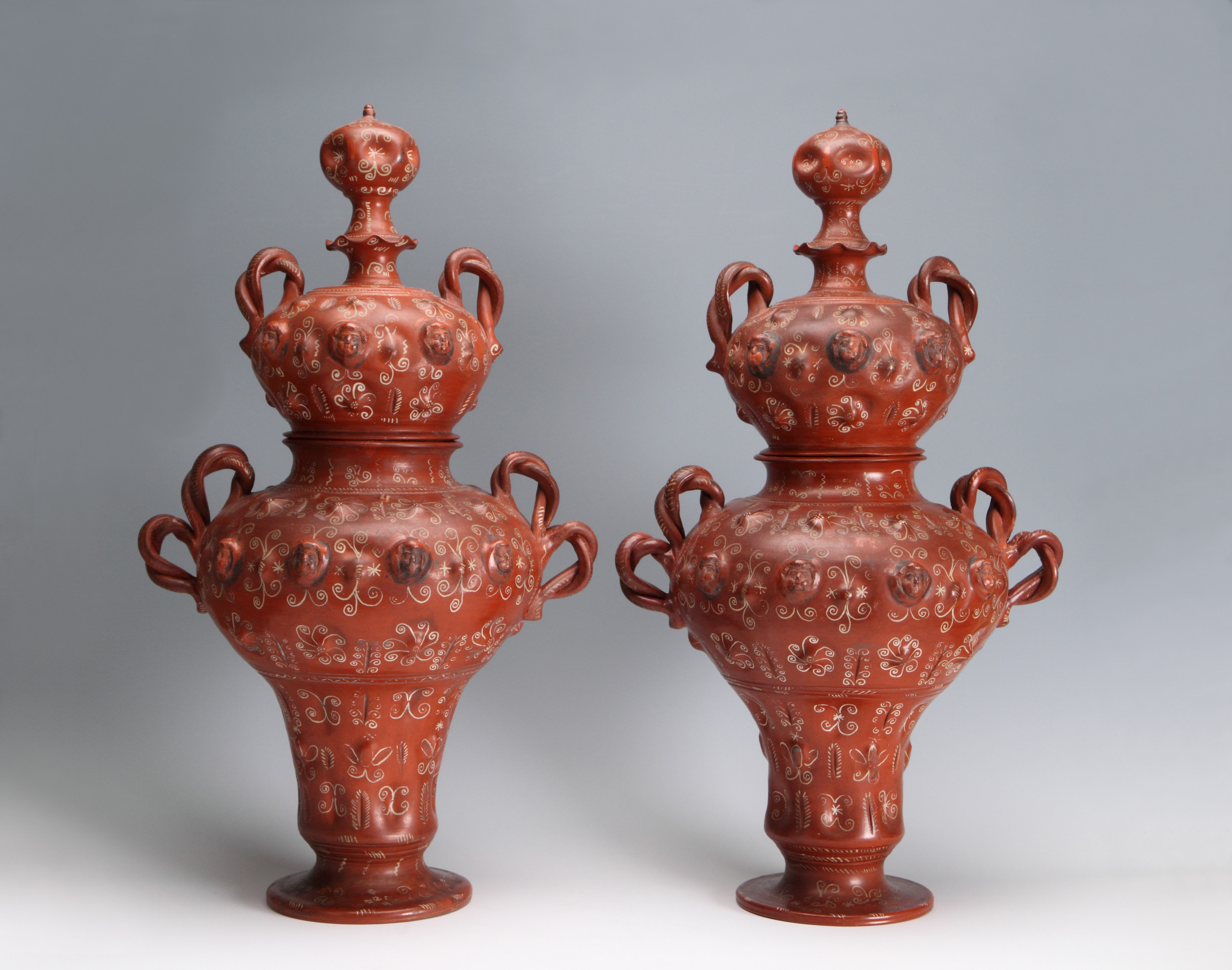 A Pair of Mexican Burnished and Slip-Decorated Vases and Covers, Tonalá, Mexico